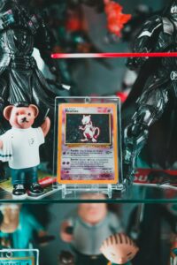 Close-up of rare Mewtwo Pokemon card displayed with various toy figures. Perfect for collectors.
